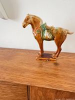 Glazed earthenware horse figurine side view