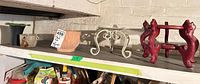Shelf view of five planters and stands