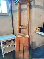 Upright frames, six shelf boards, bag of bolts on mid rail