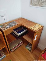 Full view of solid pine shelving unit showing shelves and corner cut-out
