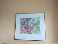 Framed watercolor hanging on wall