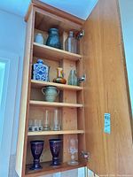 cabinet view showing all vessels on shelves