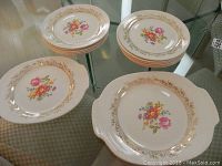 Overview of the full set including stacks of plates and two chargers