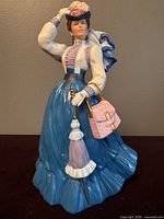 Front view showing full figurine and accessories