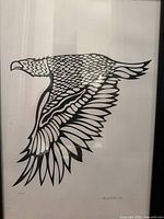 Framed print showing black line art eagle in flight