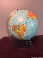 Globe on lucite stand showing South America