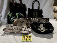 Group shot of all seven purses arranged together