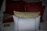 Six of the eight pillows arranged, showing color and design variety