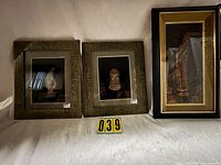 Group view of three framed shadow boxes