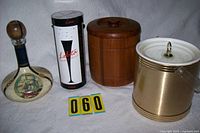 Group shot showing decanter, Lolita case, teak ice bucket, brass-tone ice bucket