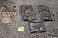 all five floor mats displayed on ground