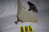 Side view showing frosted glass shade and metal finial