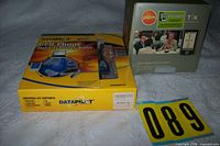 Palm TX boxed next to DataPilot kit on table with lot number