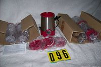overall view of blender base, cups, lids, paperwork