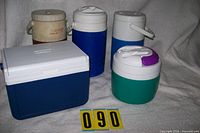 All five coolers and water jugs