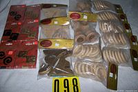 All packages laid out showing quantity and types: tie backs, pole holders, rings