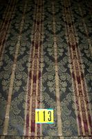 Patterned green, gold and burgundy fabric full view with measuring marker