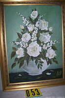 Full view of the framed floral painting