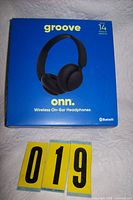 Front of sealed Groove Onn headphone box