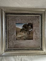 Front view of framed art showing frame, mat and print