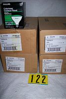 Four cases and a single boxed green bulb showing labels and count