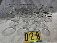 Full set of 20 silver-rim glasses in three sizes