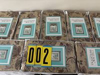 Eight packaged valances lined on table showing front labels