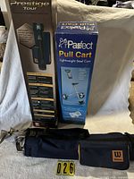 Wilson golf bag with clubs, Prestige Tour and Parfect cart boxes