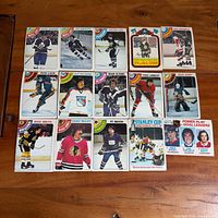 All 15 cards laid out in three rows on wood surface