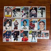 All 15 cards laid out in three rows on wooden surface