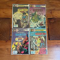 All four comic books laid out, full view of covers