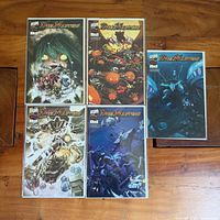 All five Duel Masters comic books laid out: two on top row, three on bottom row