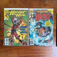 Both comic books side by side in bags