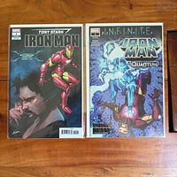 Both bagged Iron Man comics front covers