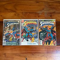 All three Adventures of Superman comics side by side