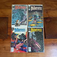 All four bagged Huntress comic books displayed