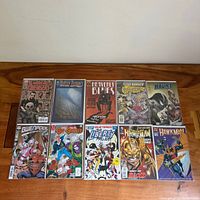 All ten comic books laid out