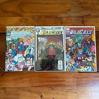 Front covers of all three WildCats comic books in sleeves