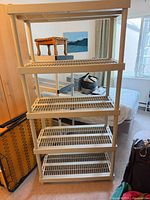 Full front view of beige 5-tier plastic shelving unit