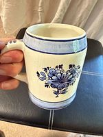 Side view with floral motif and handle