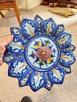 Front view of scalloped Portuguese ceramic wall plate