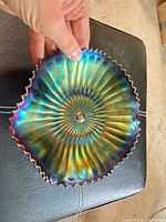Top view showing radial ribbed sunburst pattern and iridescent finish