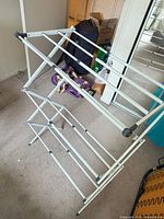 Rack fully expanded showing three tiers and metal frame