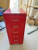 Front view showing six drawers with silver handles and label slots