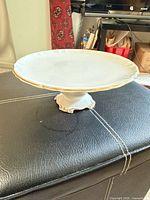 Top view of white bone china pedestal cake stand with gold trim