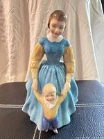 Front view of figurine showing mother and child details