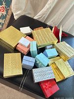 Assorted jewelry boxes spread on surface
