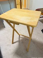 folding wooden TV tray open, three-quarter view