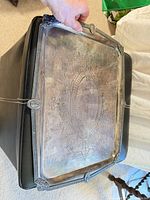 Top view of tray showing ornate engraving and rim