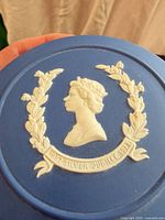 Top view showing Queen Elizabeth II profile, laurel wreath, and Silver Jubilee banner